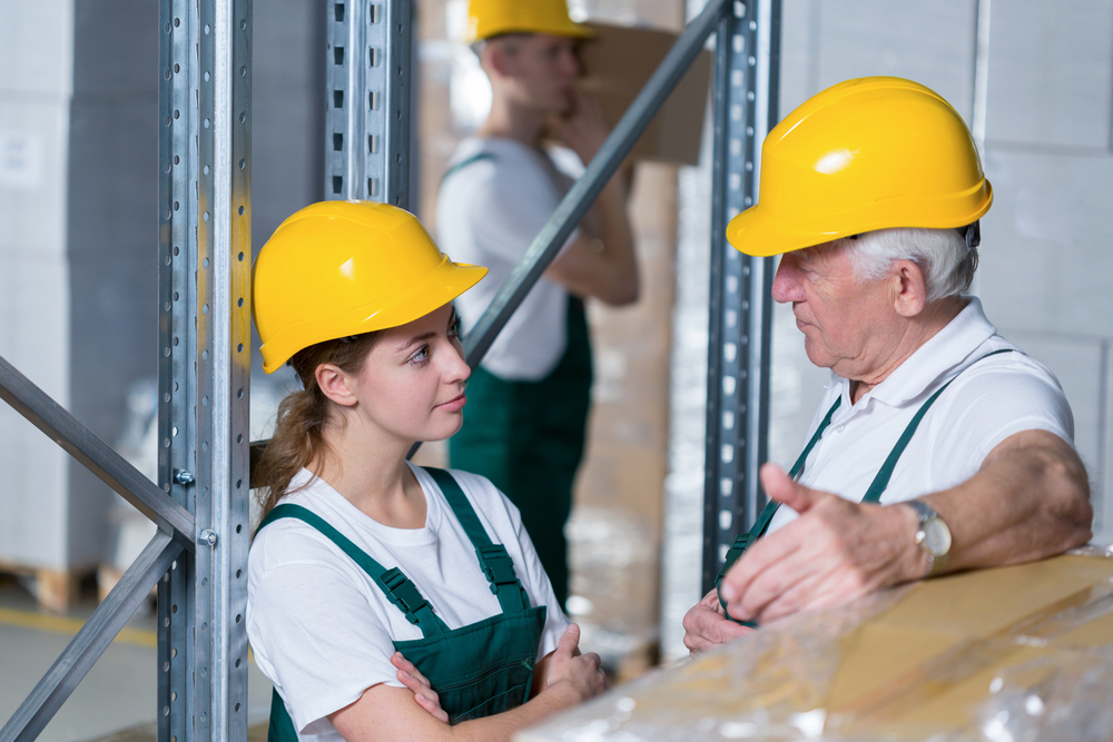 Storage workers during their work in warehouse