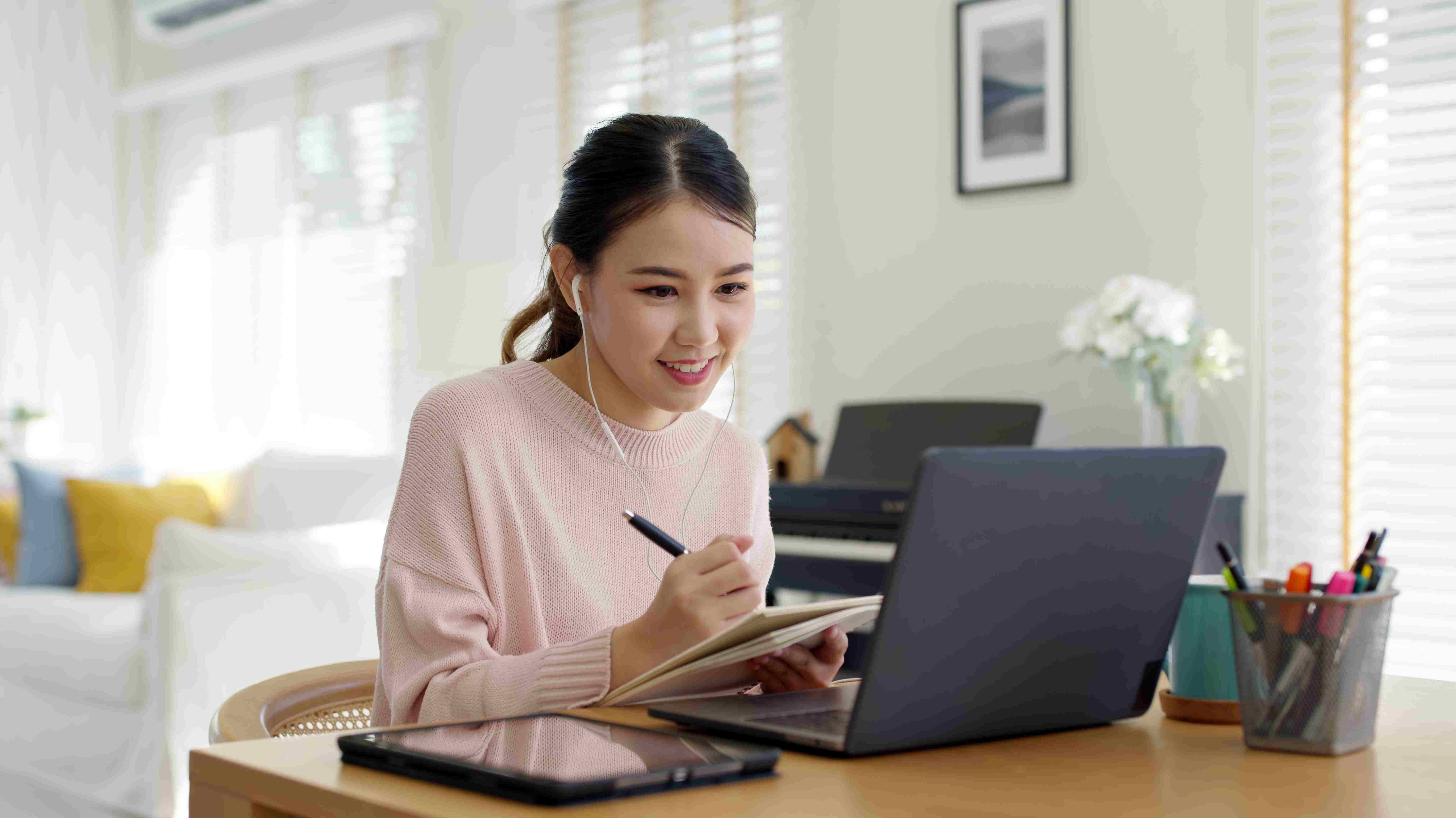 a woman putting together her personal business development plan at home