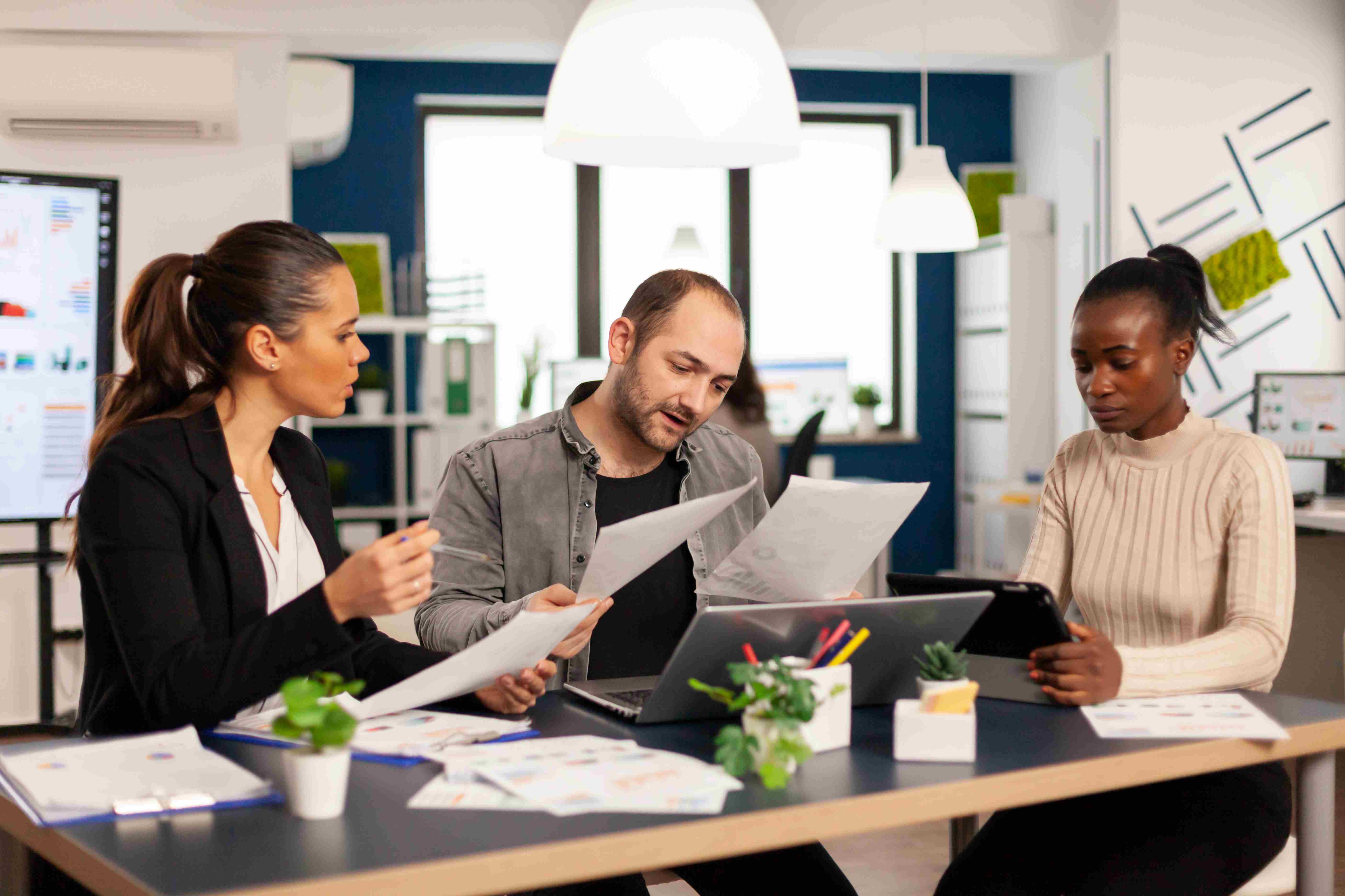 three people who are investing in leadership development